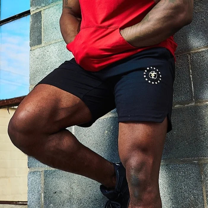 Black athletic shorts with logo detail, ideal for workout or casual wear.