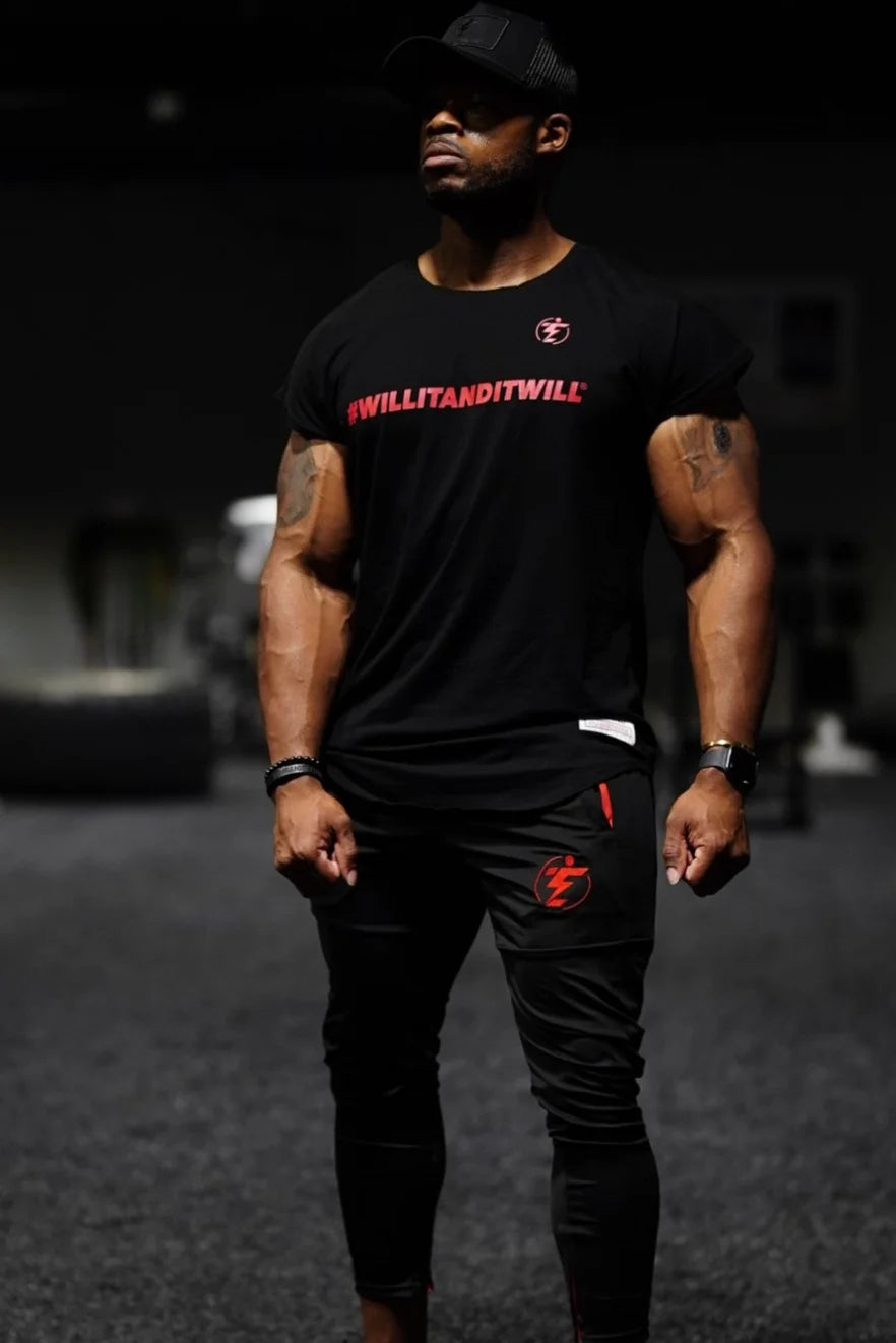 Man in black athletic T-shirt with red logo and matching joggers. #WILLITANDITWILL