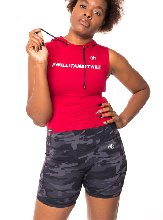 Woman in red sleeveless hoodie with "#WILLITANDITWILL" text and grey camo high-waisted athletic shorts.