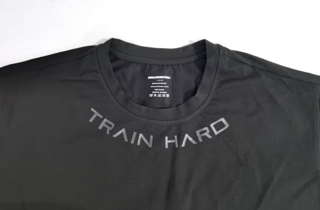 Black athletic t-shirt with 'Train Hard' text.