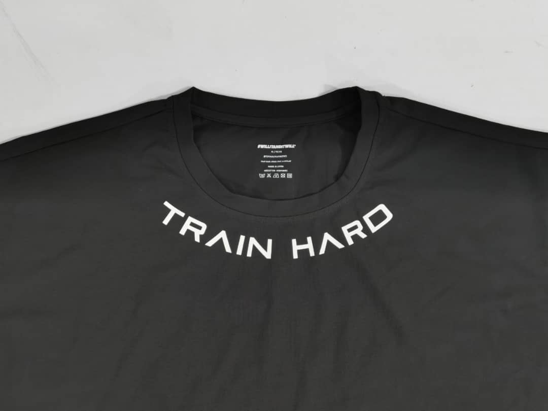 Black athletic t-shirt with 'TRAIN HARD' in white lettering across the chest.