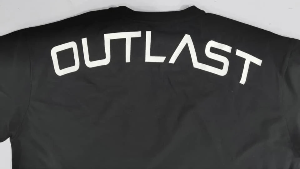 Black 'OUTLAST' branded t-shirt, back view.