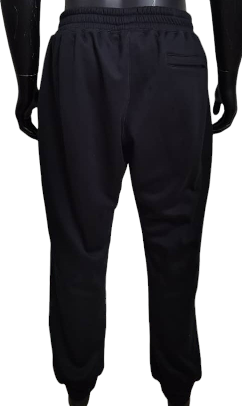 Back view of black sweatpants with elastic waistband and back pocket.